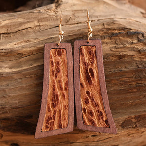Tooled leather and wood drop earrings in Style D with a bohemian design.