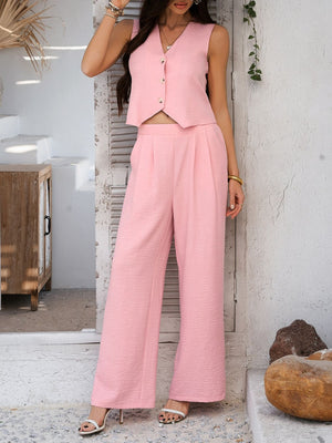 Blush pink textured crop vest and wide leg pants set with button details.