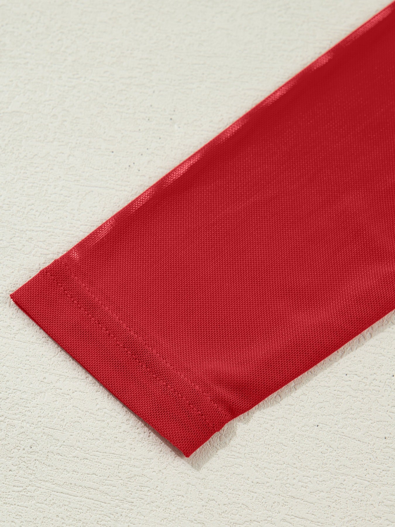 Deep red sheer mesh maternity blouse with long sleeves and a high neck detail.