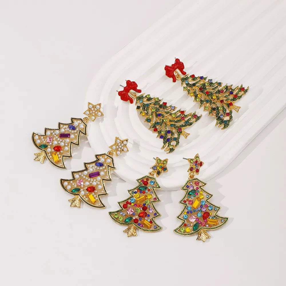 Festive rhinestone tree dangle earrings with red bows, white stars, and colorful gems.