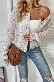 Confetti knit button-up cardigan in white with multicolor speckles, featuring a relaxed fit and button closure.