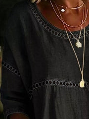 Navy bohemian t-shirt with openwork trim detail at neckline and waist.