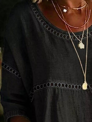 Navy bohemian t-shirt with openwork trim detail at neckline and waist.