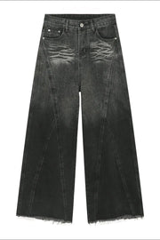 Faded panel wide-leg jeans in dark denim with a raw hem.