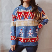 Festive Fair Isle knit jumper in blue with gingerbread men and geometric patterns. Acrylic.