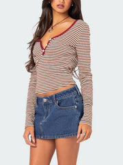 Striped Henley shirt with contrast collar and button detail.