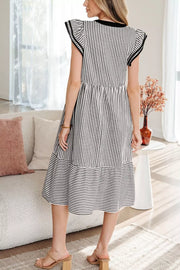 Black and white striped cotton midi dress with tiered skirt and flutter sleeves.
