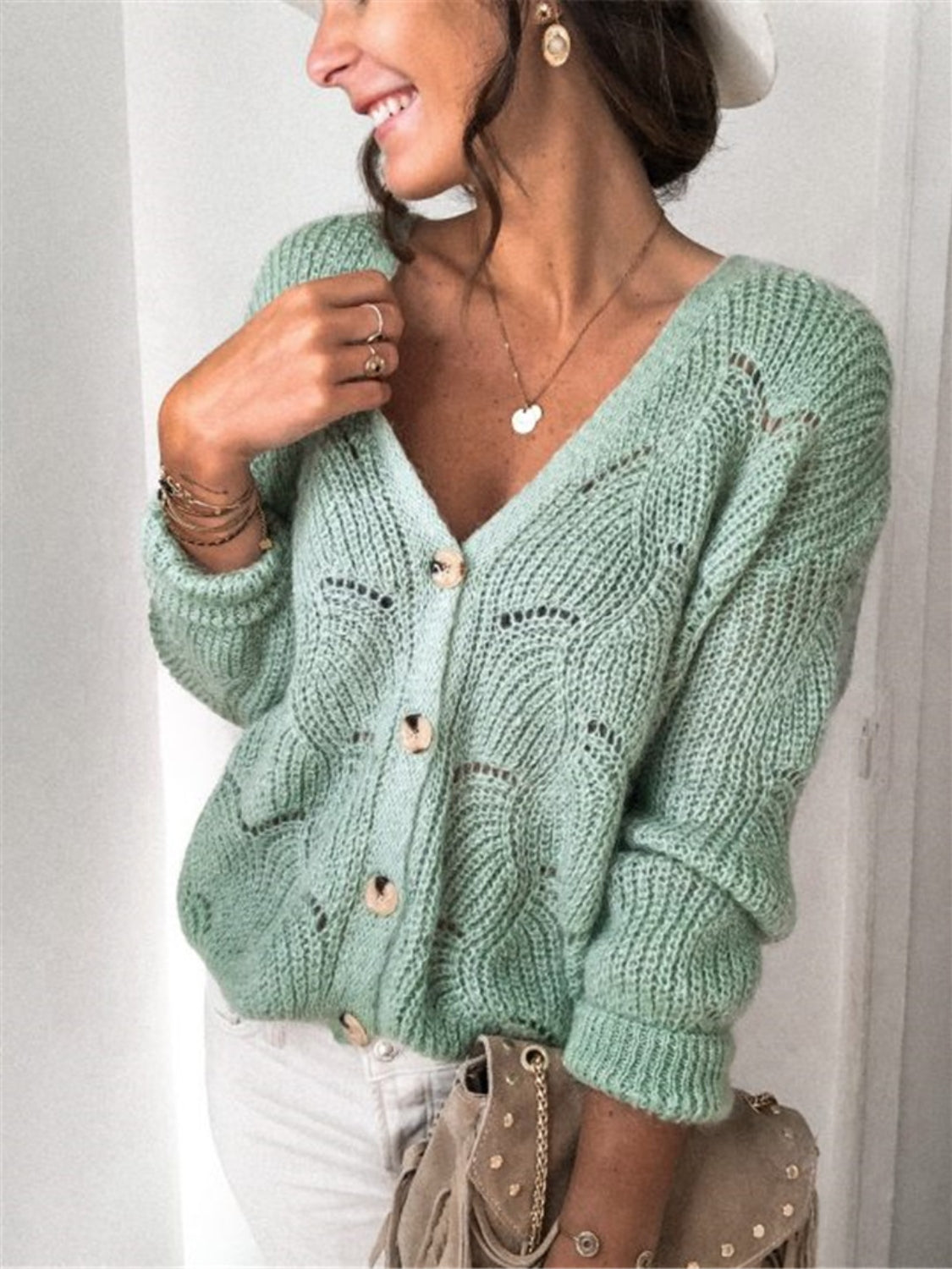 Light Green scalloped knit button-down cardigan with V-neck and openwork detail.