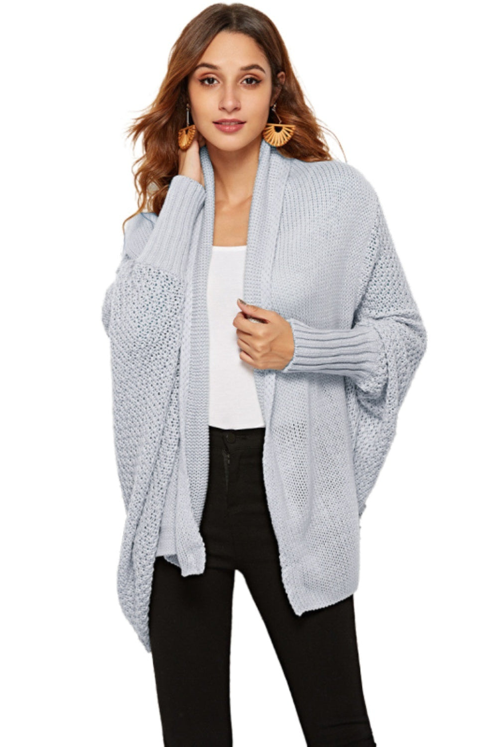 Light blue acrylic cocoon cardigan with shawl collar and batwing sleeves.