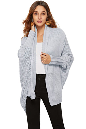 Light blue acrylic cocoon cardigan with shawl collar and batwing sleeves.