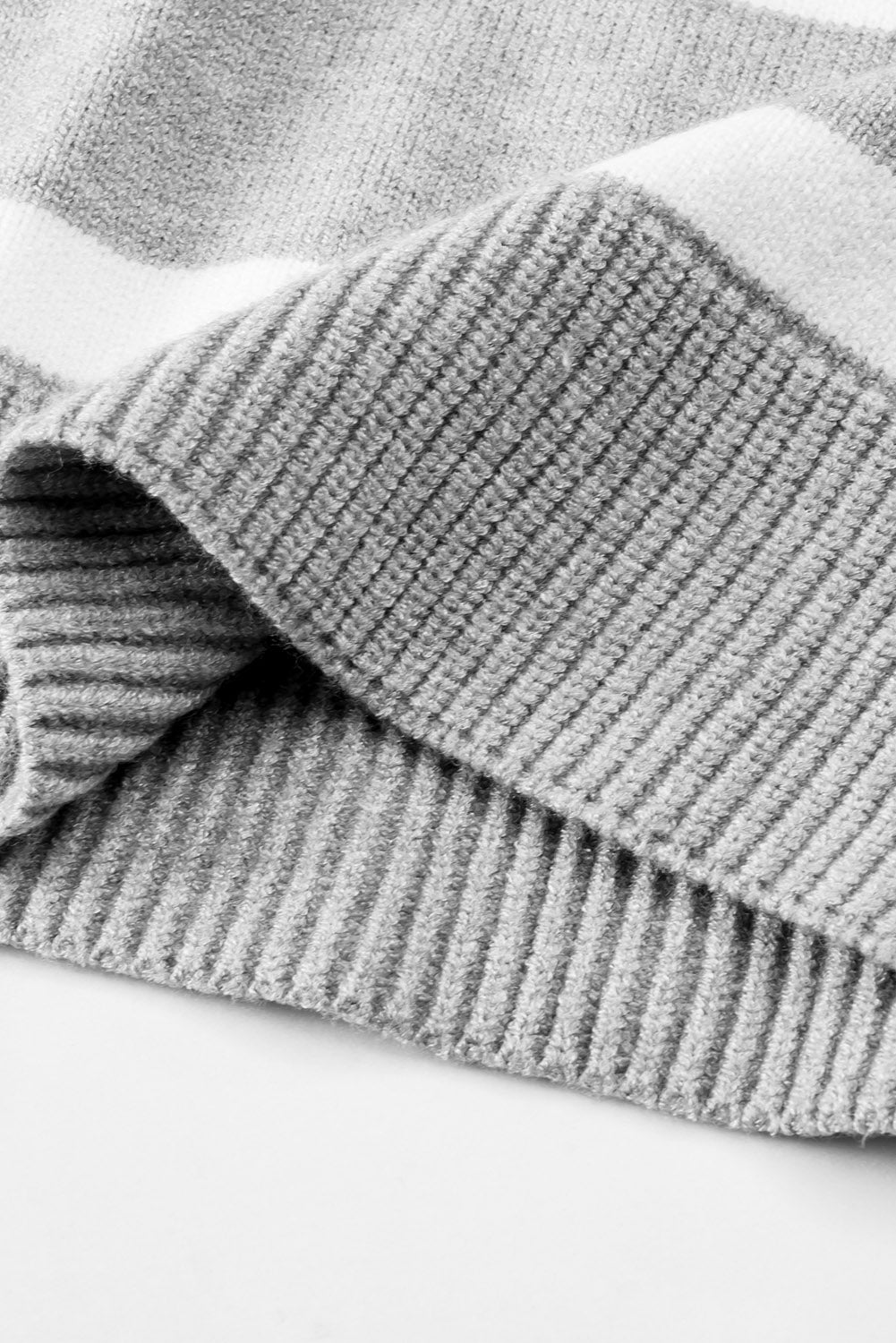 Light gray and white striped knit pullover sweater with wide collar detail.