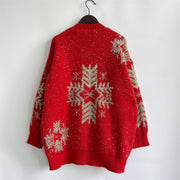 Red knit sweater with gold snowflake embellishments and metallic threads.