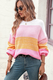 Ombre ribbed knit sweater with balloon sleeves in pink, yellow, and white stripes.