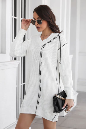 White V-neck sweater dress with black stitch detail and long sleeves.