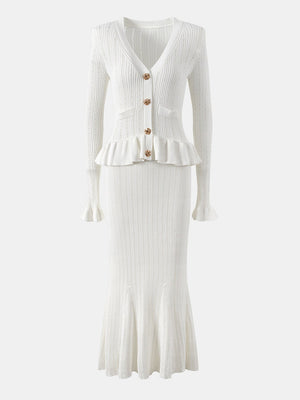 White knit cardigan and skirt set with ruffled hem and flared sleeves.