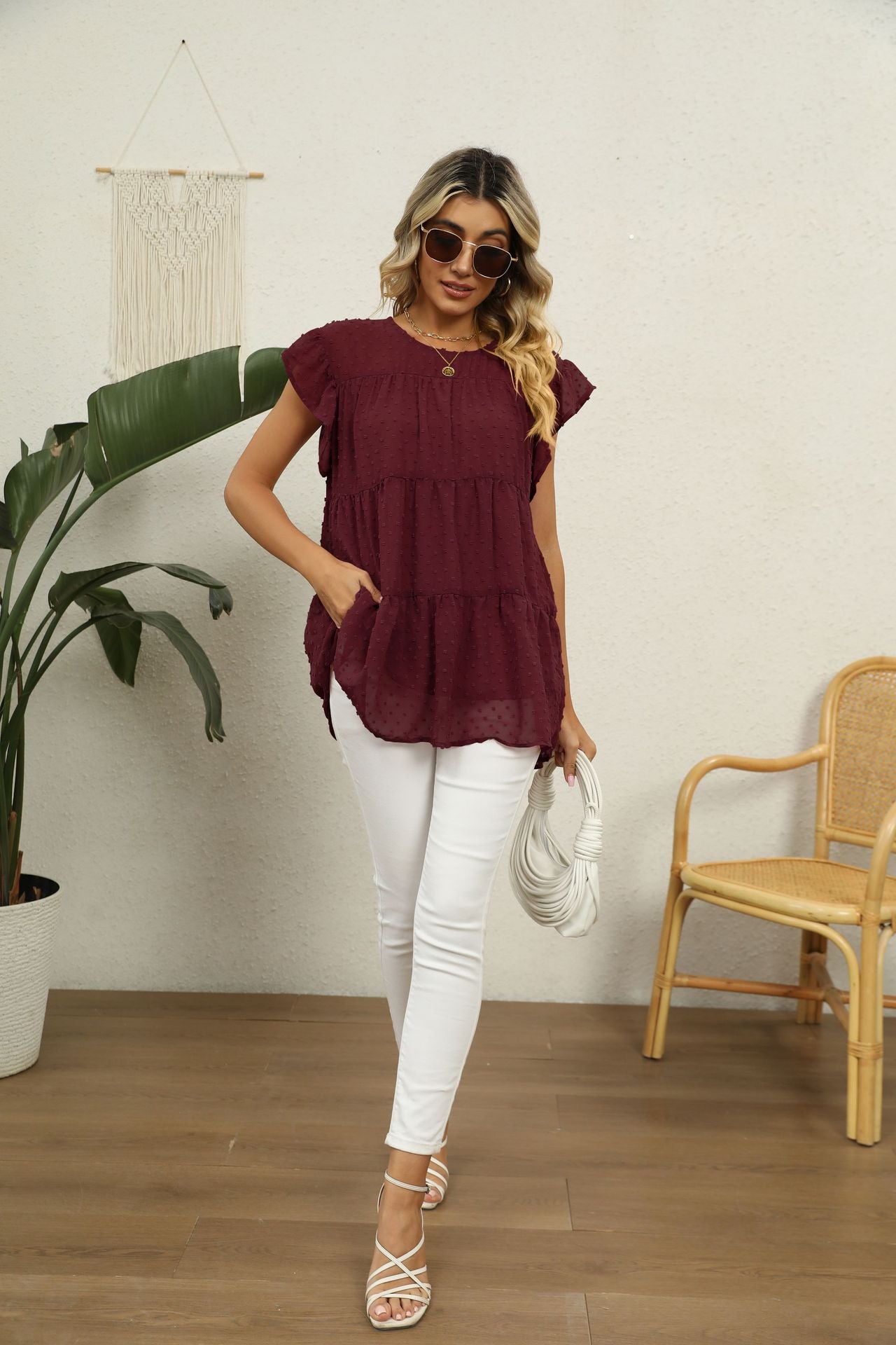 Swiss dot flutter sleeve blouse in Brick Red with tiered ruffle hem and pockets.