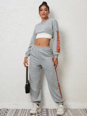 Heather gray graphic sleeve crop sweat set with matching joggers.