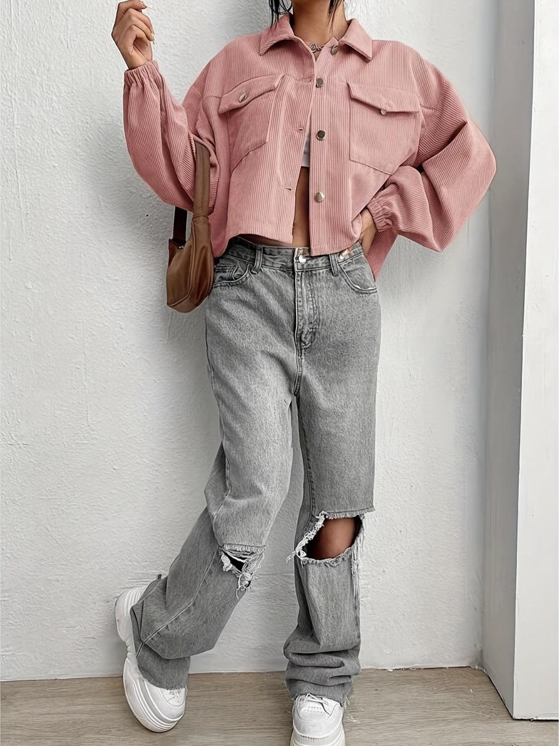 Pale blush corduroy blouson jacket with button front and chest pockets.