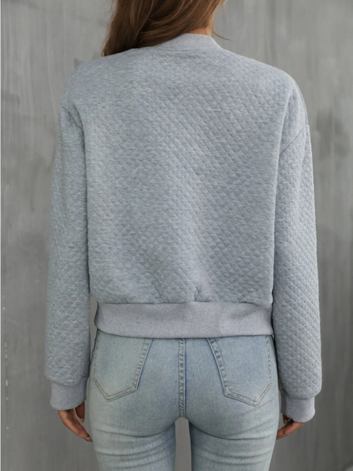 Gray diamond quilted bomber jacket with ribbed cuffs and hem