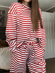 Chic striped two-piece lounge set in scarlet and white, featuring a long-sleeve top and drawstring pants.