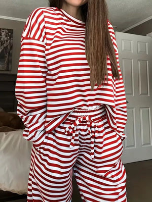 Chic striped two-piece lounge set in scarlet and white, featuring a long-sleeve top and drawstring pants.