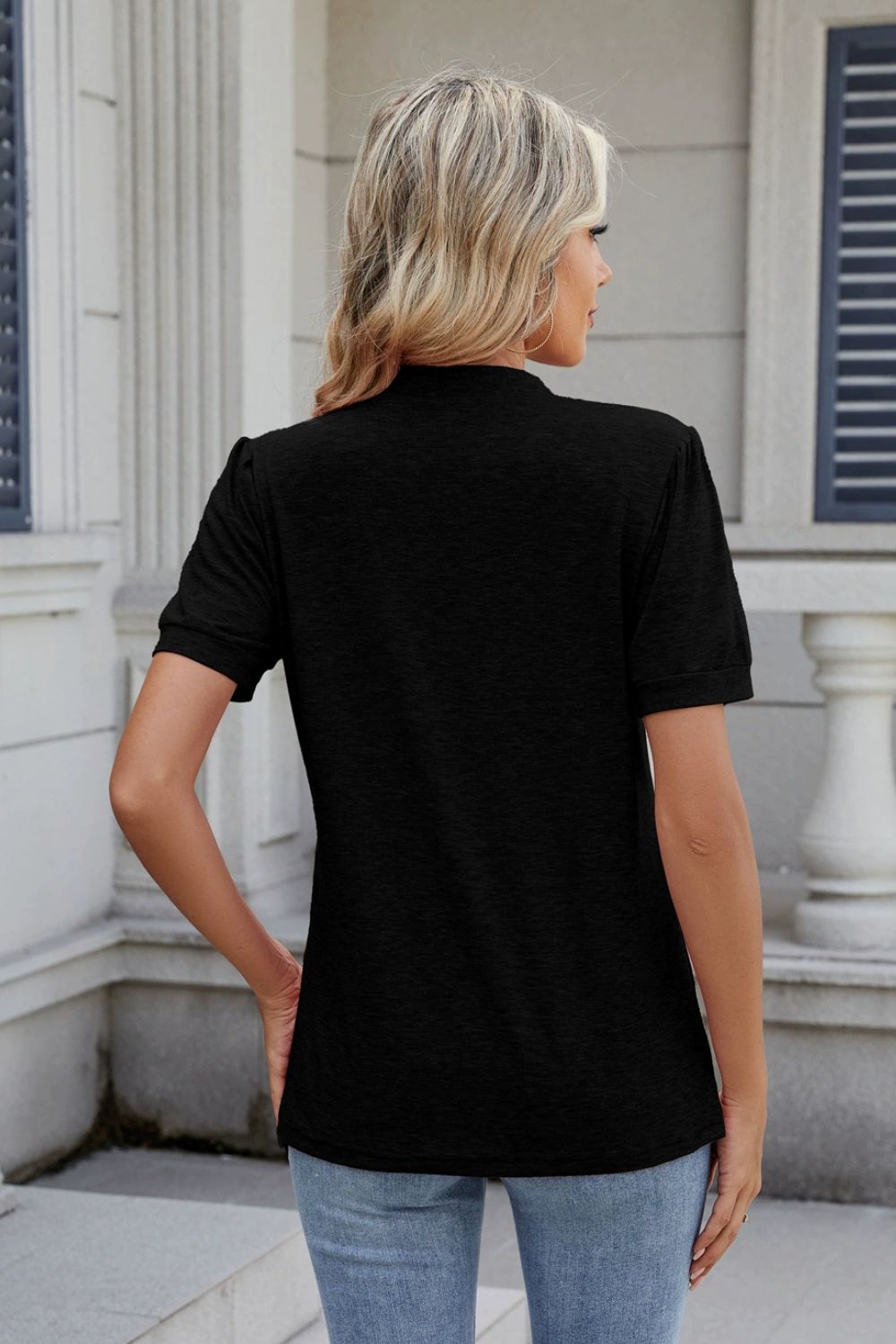 Black pleated yoke keyhole tee with short sleeves.