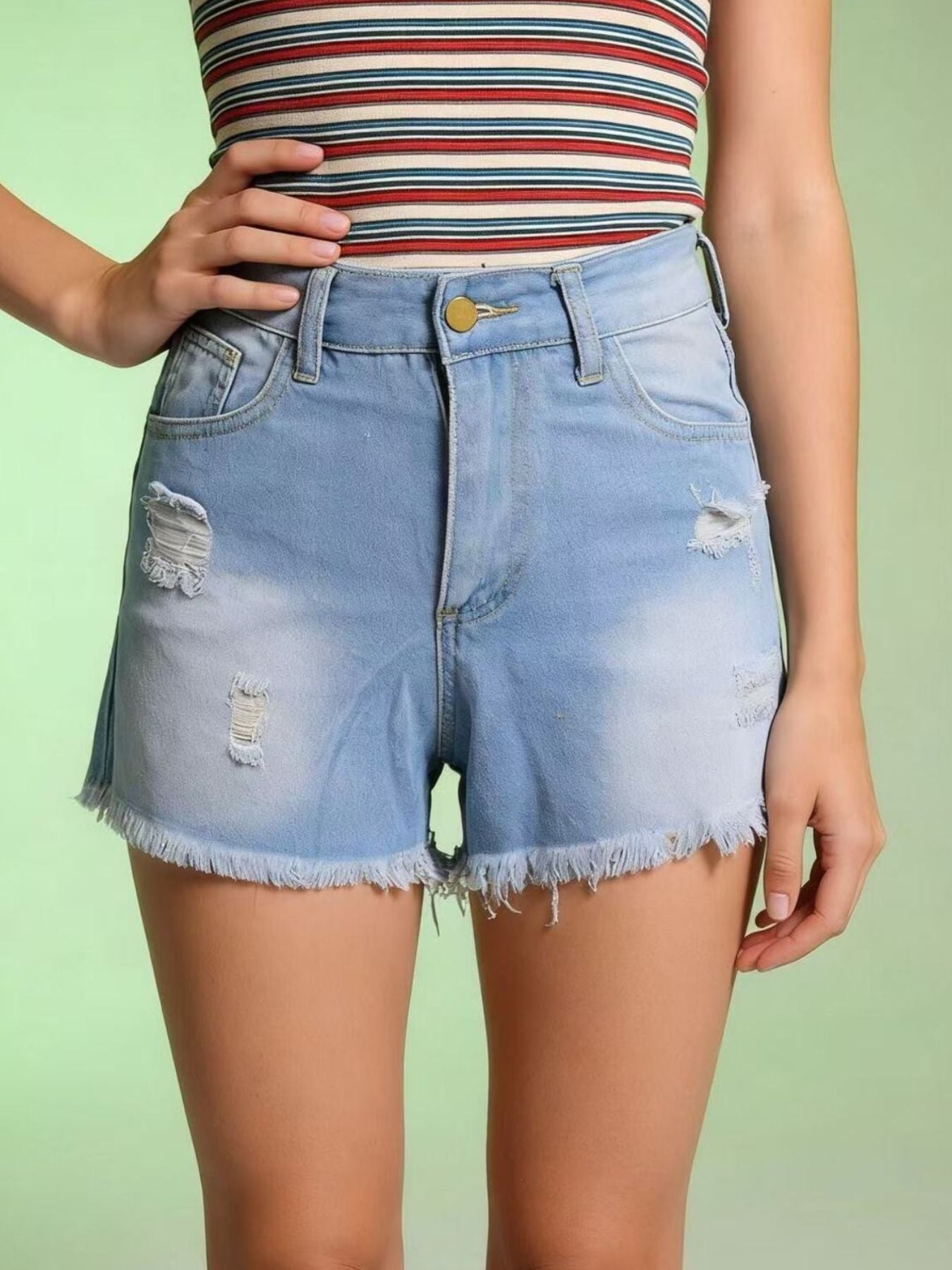 Light blue distressed denim shorts with frayed hem and high waist.