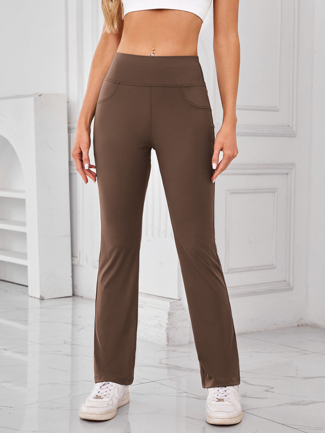 Camel flared activewear pants with pocket detail and high waist