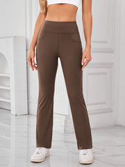 Camel flared activewear pants with pocket detail and high waist