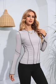 Mid Gray ribbed long sleeve top with contrast stitching and crew neck.