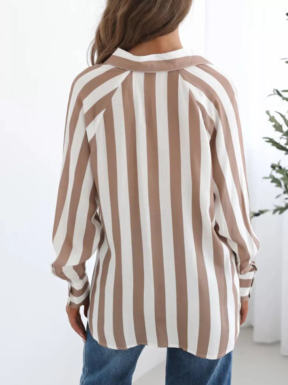 Maternity shirt with brown and white vertical stripes, button-front, and long sleeves.