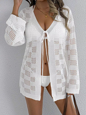 White openwork crochet tie-front cover-up with V-neck and long sleeves.