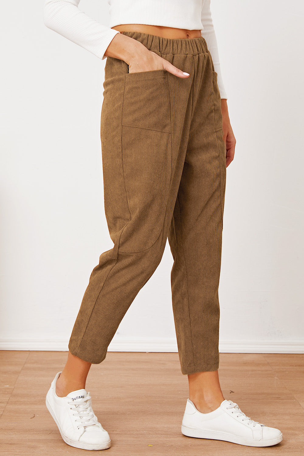 Camel corduroy barrel-leg utility pants with elastic waist and patch pockets.
