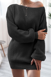 Black off-the-shoulder ribbed knit mini dress with long sleeves and a boat neckline.
