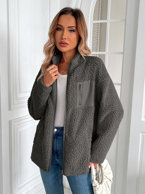 Dark gray teddy fleece jacket with zip front and chest patch pocket.