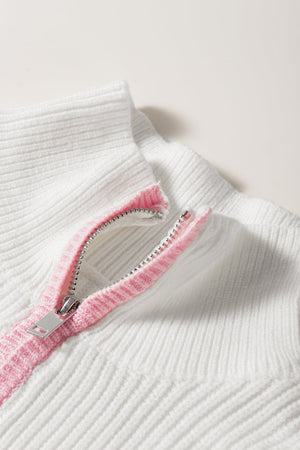 White ribbed quarter-zip pullover with pink trim detail on zipper.