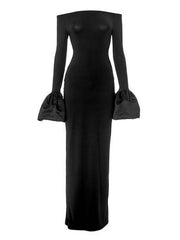 Black off-shoulder maxi dress with dramatic satin bell sleeves.
