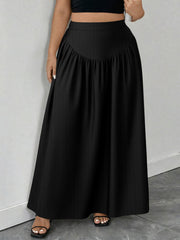 Black maxi skirt with a-line cut and gathered waist detail.