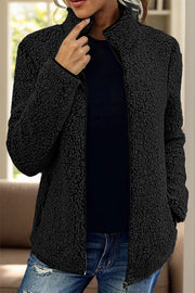 Black teddy fleece zip-up jacket with a stand collar and full zip closure.