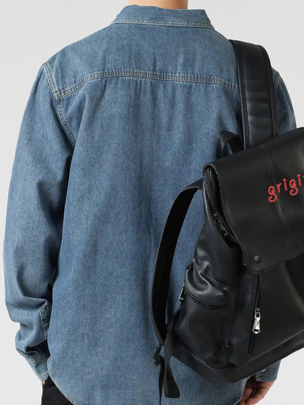 Blue denim shirt, relaxed fit, buttoned, 100% cotton, shown from the back.