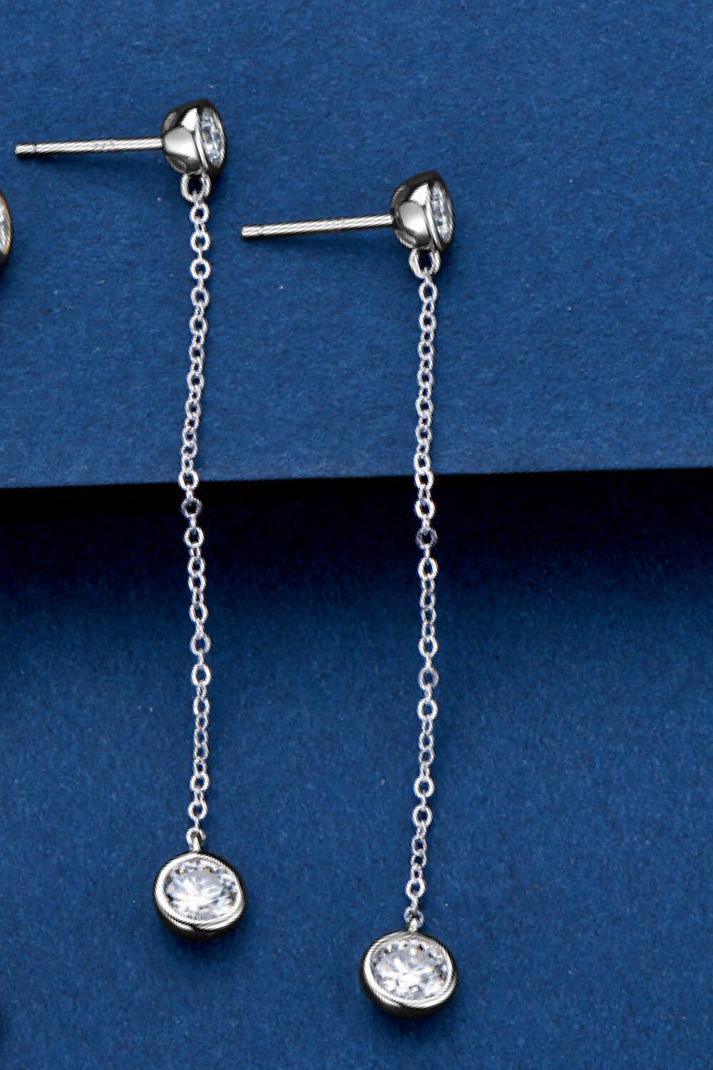 Silver chain drop earrings with a bezel-set crystal charm