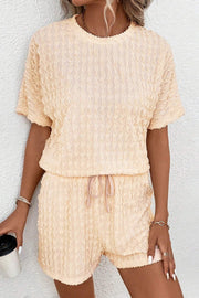 Pastel yellow textured wave co-ord lounge set with drawstring shorts and short sleeve top.