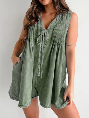 Moss green denim tie-front playsuit with V-neck, pleats, and pockets.