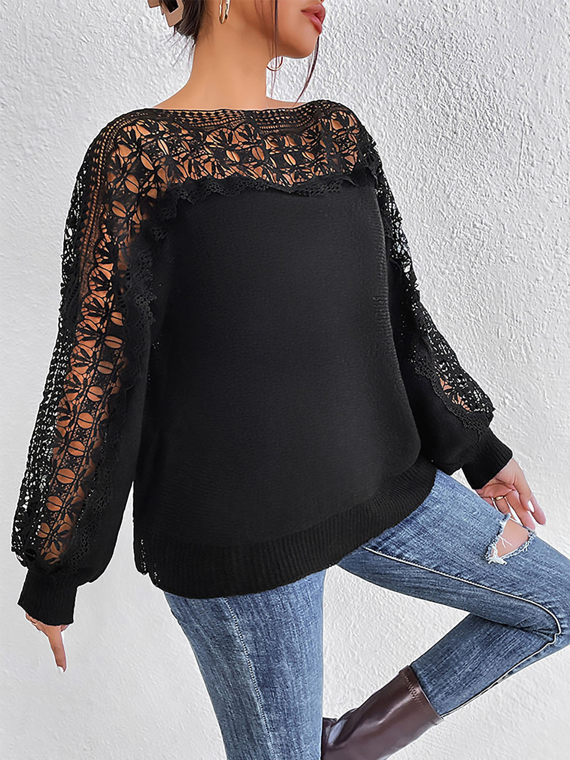 Black acrylic sweater with lace inset balloon sleeves and boatneck.