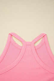 Ribbed cropped tank top in dusty pink with racerback detail and contrast trim.
