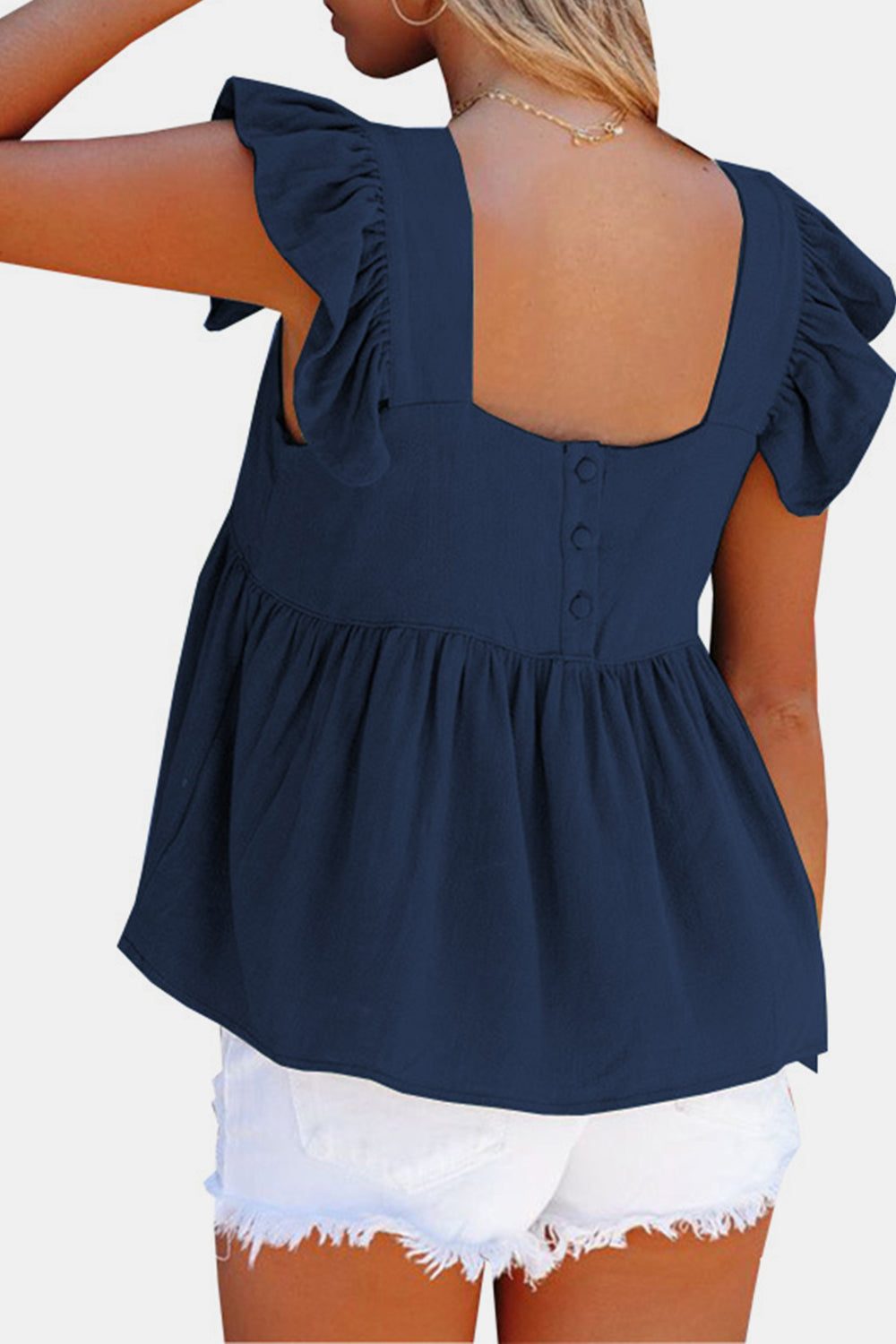 Dark blue linen babydoll top with flutter sleeves and square neckline, button back detail.