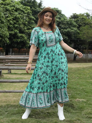 Green floral maxi dress with square neck and tiered hem, short sleeves