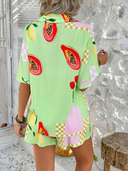 Light green fruit print co-ord set with papaya, lemon, and cherry motifs, featuring a button-up shirt and shorts.