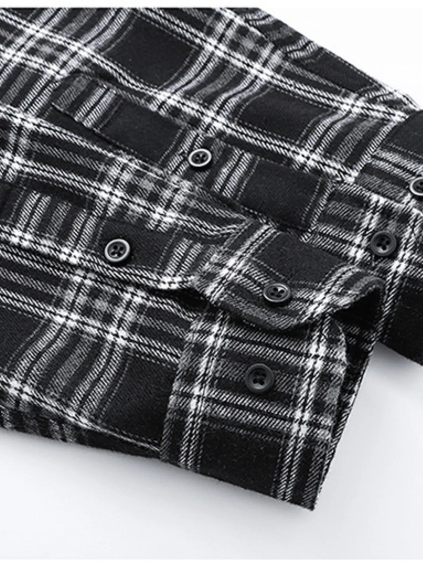 Men's black plaid button-up shirt with cotton blend fabric and button details.