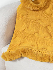 Gold cable knit poncho with faux fur trim and open knit detail